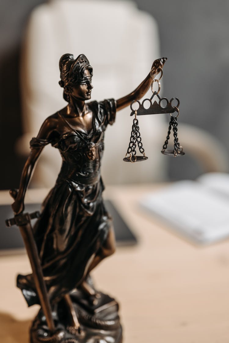 A Figurine Of Lady Justice