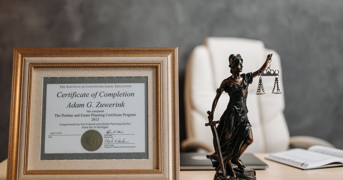 A professional desk displaying various recognised cybersecurity certification plaques.