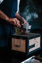 Person Holding a Gray Metal Kettle