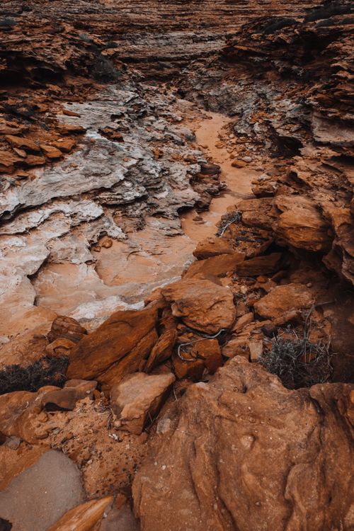 Free Explore the rugged texture of eroded sandstone formations, showcasing nature's artistry in an arid landscape. Stock Photo