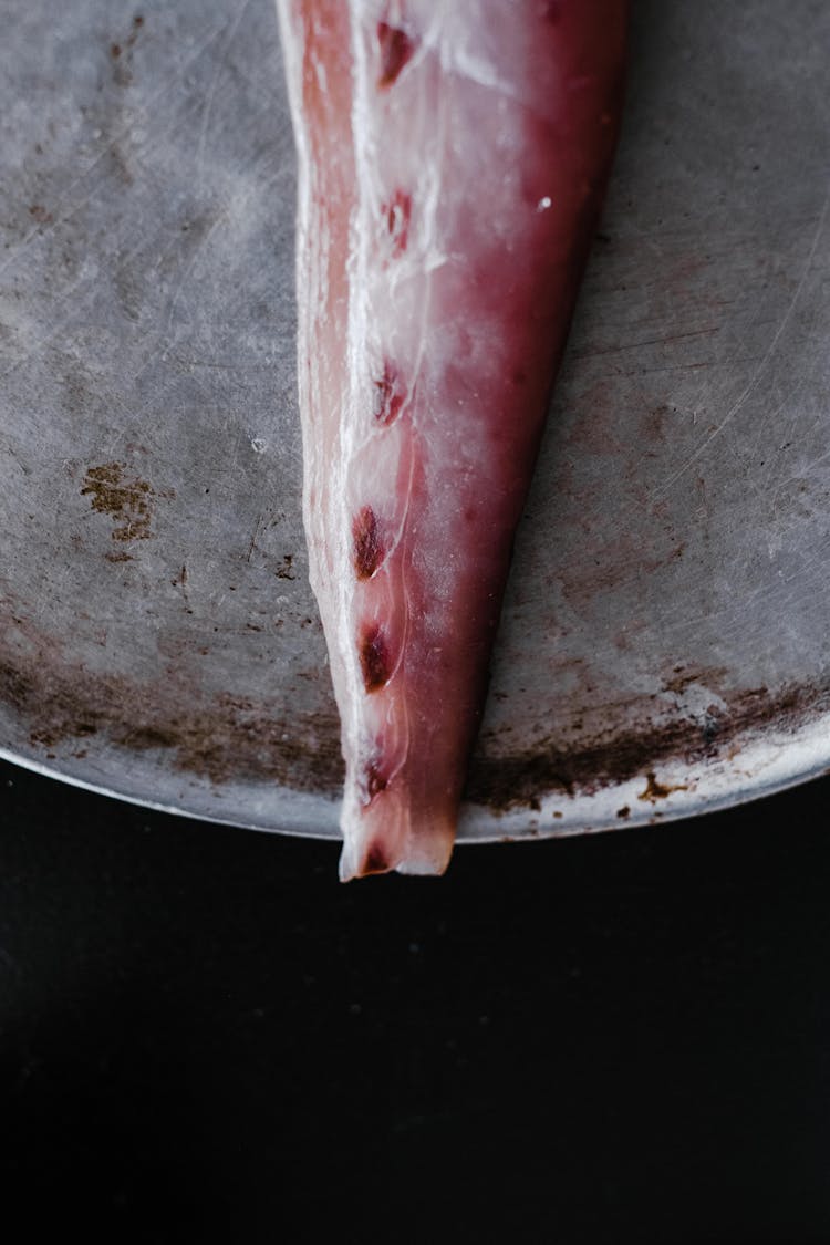 Fish Fillet On Plate On Black Background