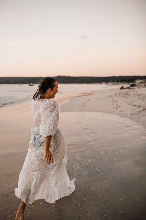 Woman in White Dress at the Beach