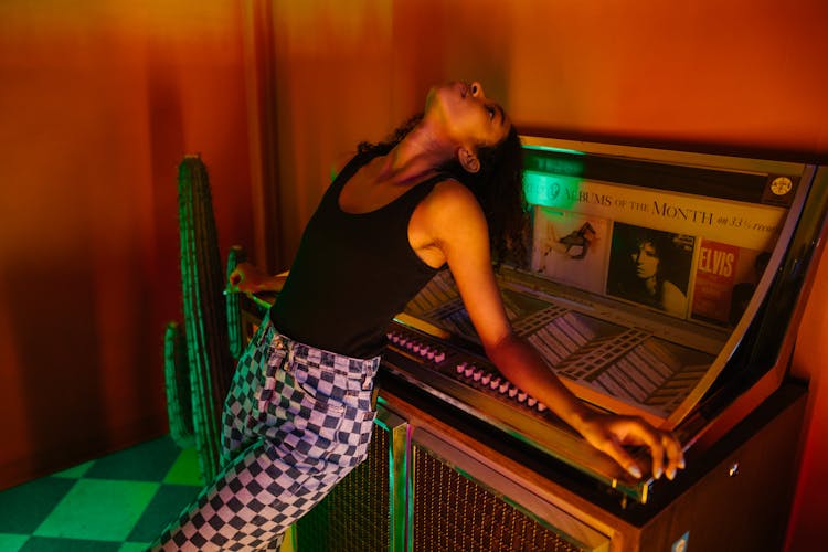 Woman Leaning On A Jukebox