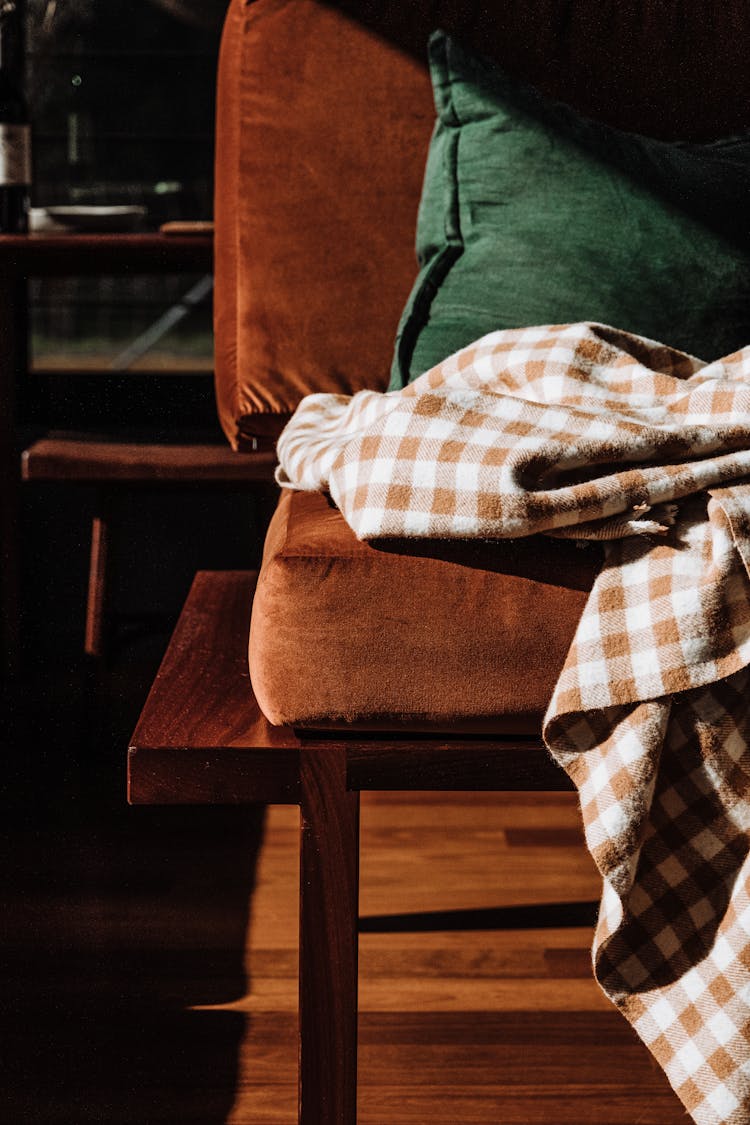 Close-up Of A Corner Of A Brown Velvet Couch 