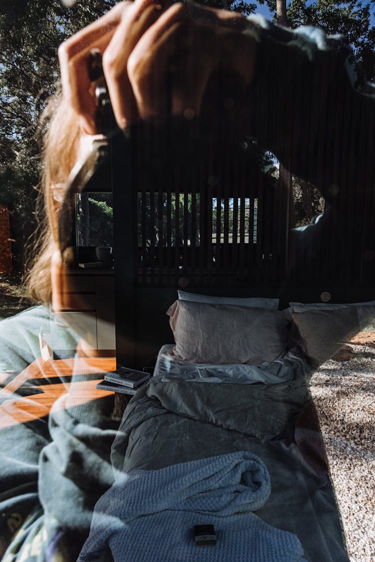 Woman Making Photo Through Window