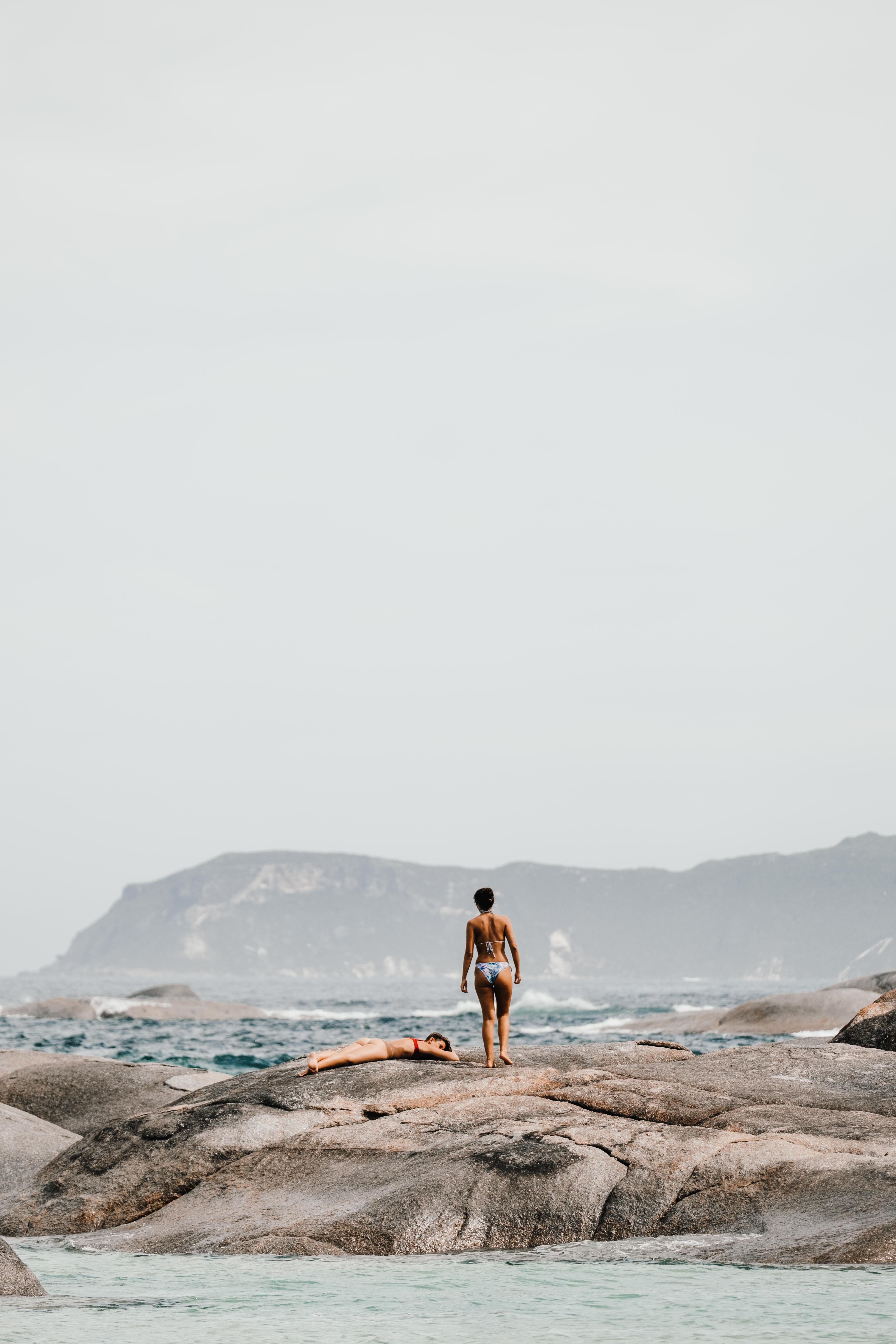 People on Rocks near Water · Free Stock Photo