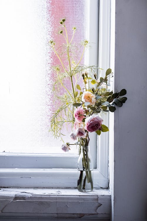 Flowers in a Vase by the Window