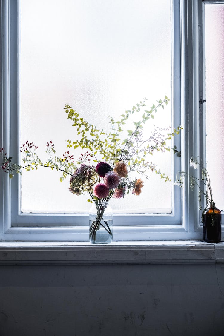 Flowers In Vase On Windowsill