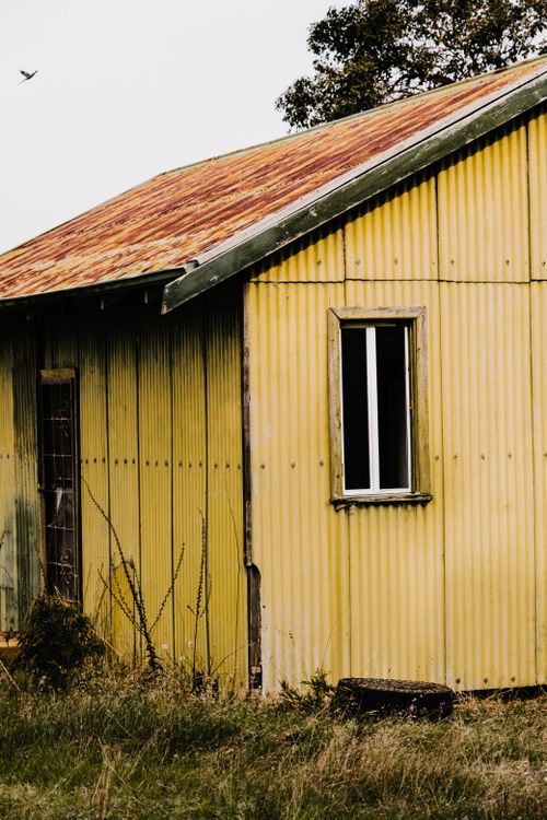 Abandoned House with a Yellow Facade · Free Stock Photo