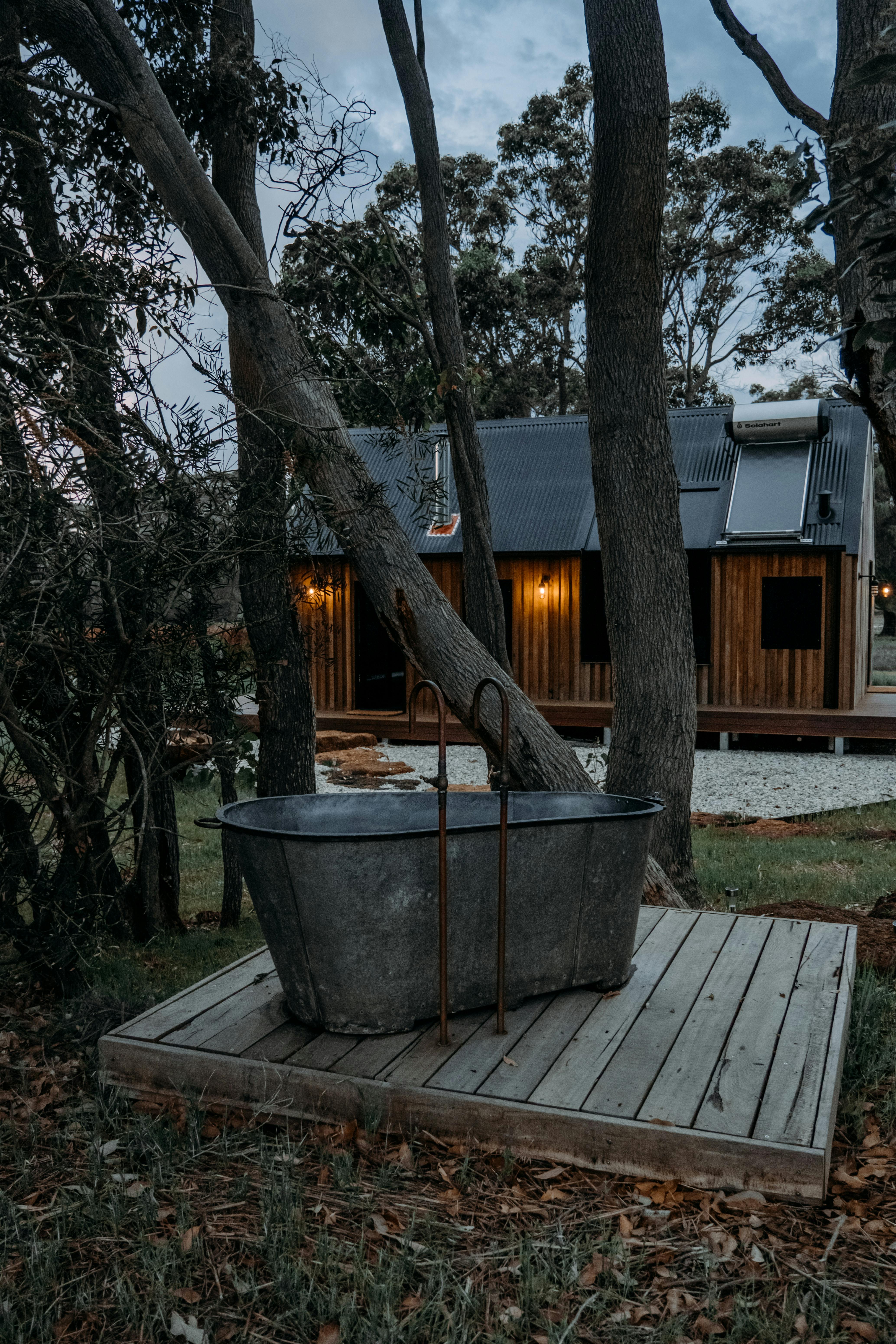 Bathtub with Ladder near Wooden House · Free Stock Photo