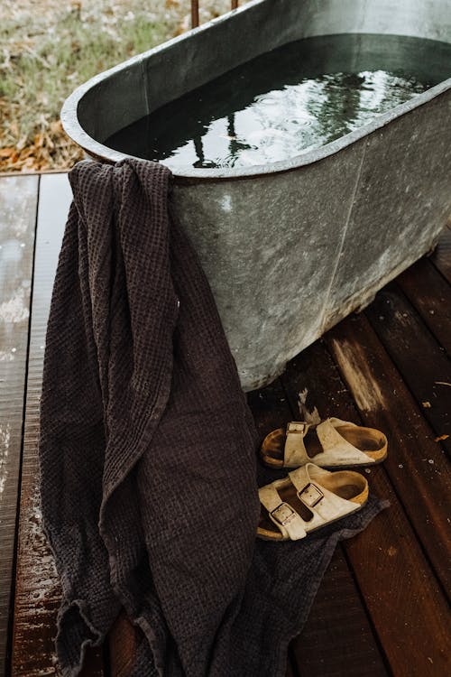 Shoes and Towel by Bathtub