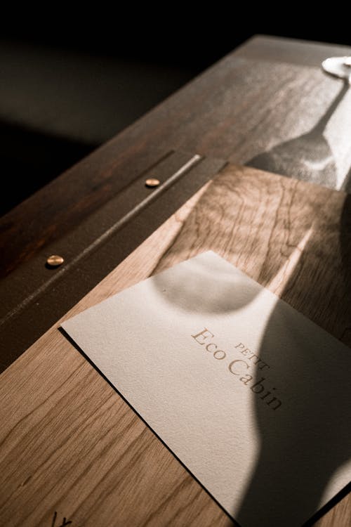 Close-up of an Elegant Menu on a Wooden Table 