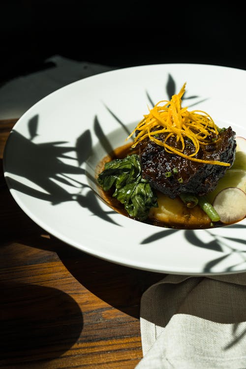 Sunlight and Shadow around Plate with Food