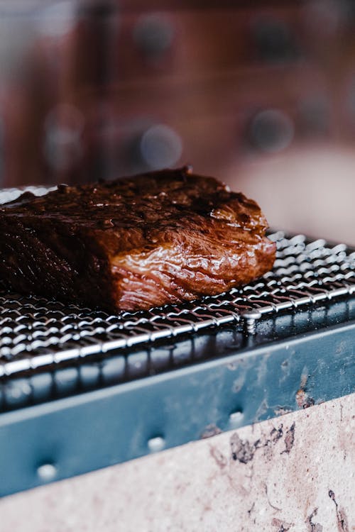 Close-Up Photo of a Piece of Meat Getting Grilled