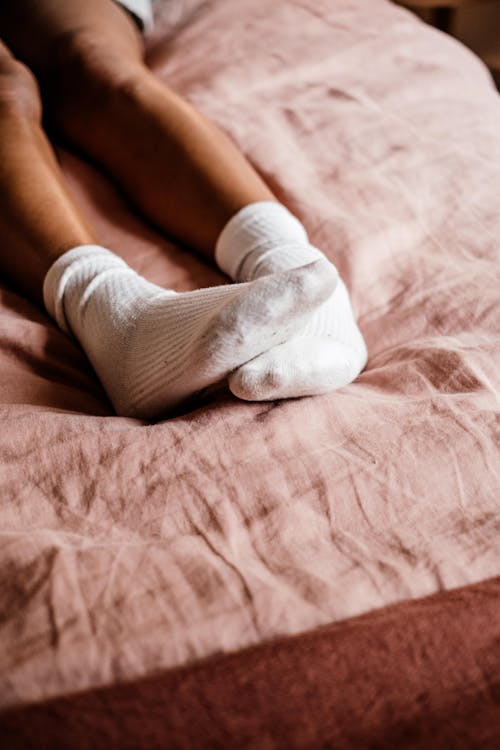 Free Photograph of a Person's Feet with White Socks Stock Photo