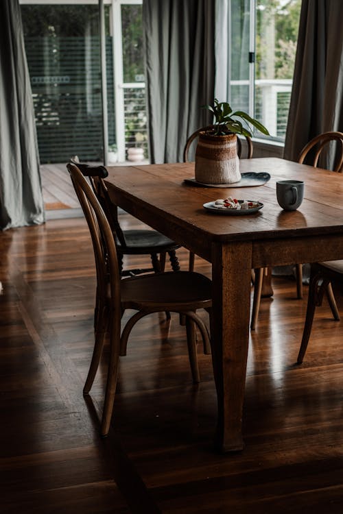 Photograph of a Brown Wooden Table with Wooden Chairs