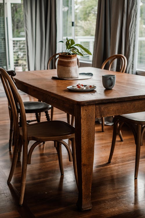 Coffee Mug on Brown Wooden Dining Table 