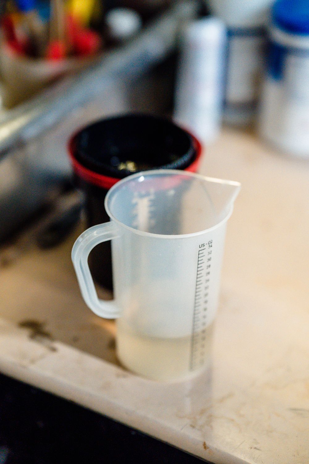 Transparent plastic measuring cup with scale markings
