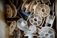 White and Brown Plastic Reels in the Box