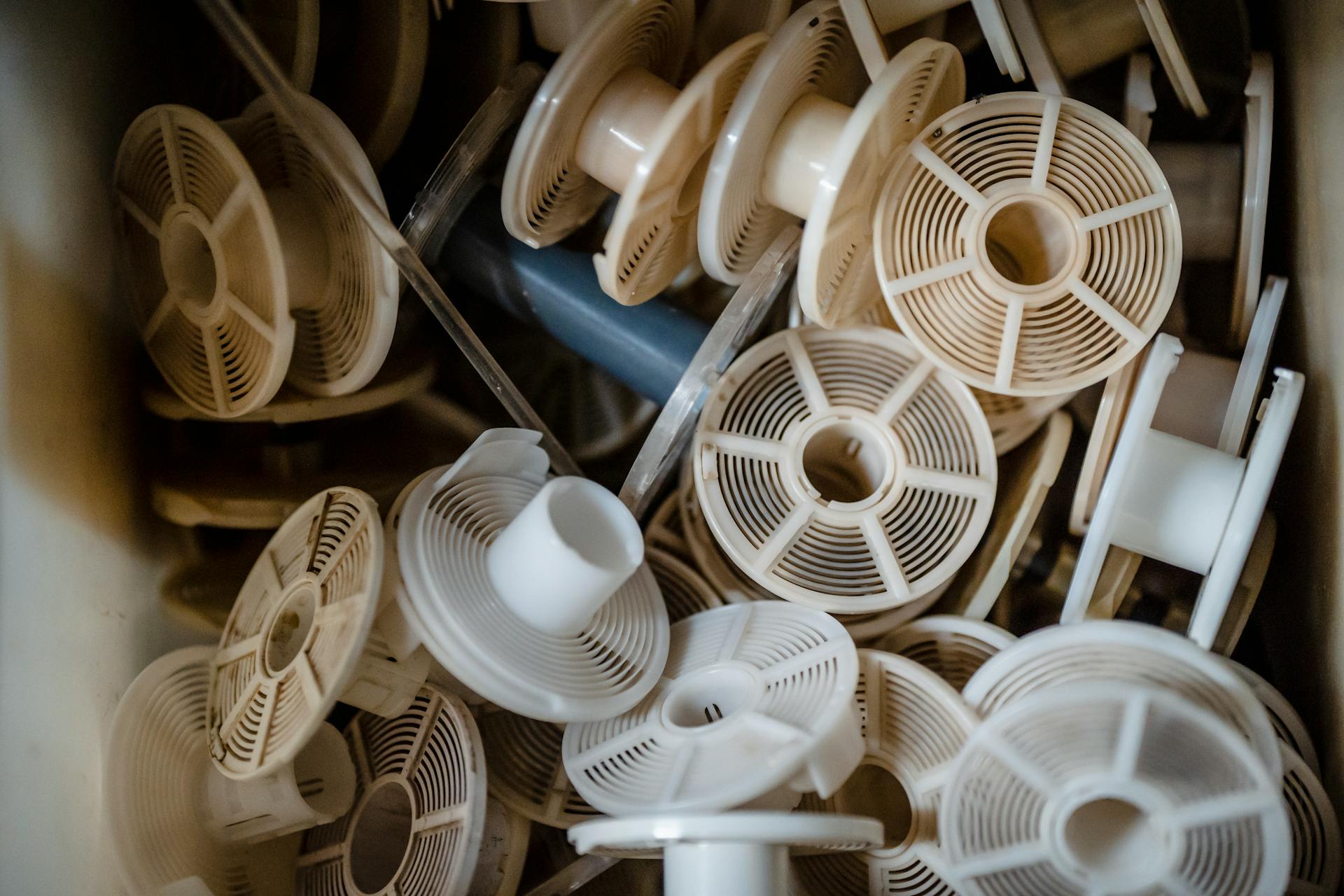 White and Brown Plastic Reels in the Box