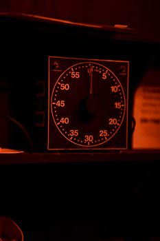 Close-up of an antique darkroom timer with a classic dial and bold numbers.