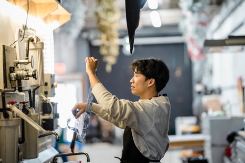 Free Adult processing film in a laboratory setting. Passion for analog photography. Stock Photo