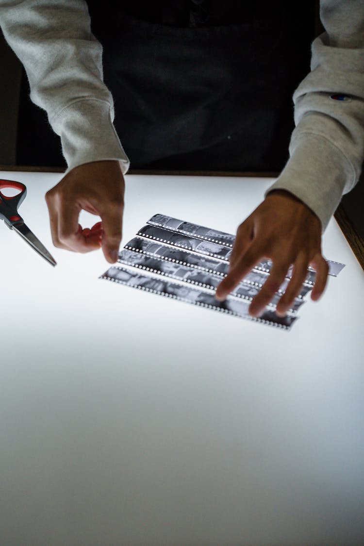 Man Developing Pictures In A Darkroom