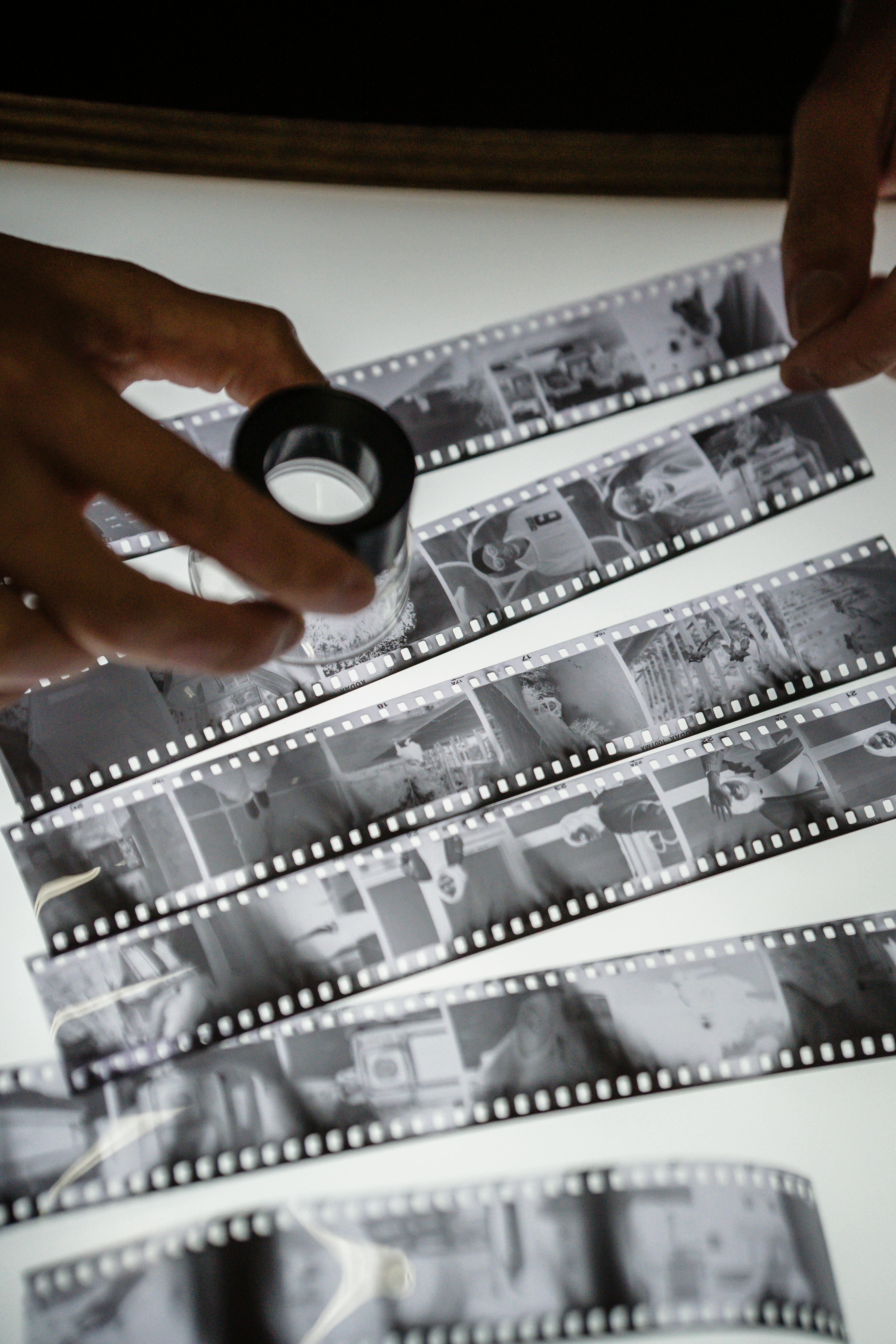 A Person Checking the Film Strip · Free Stock Photo