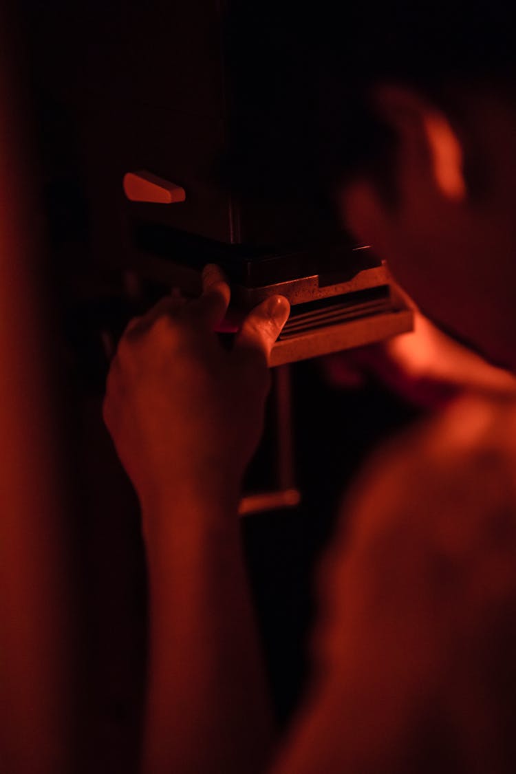 Man Working In Darkroom