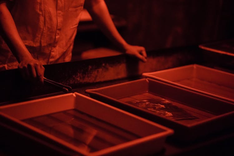 Darkroom Containers Covered In A Red Fluorescent Light