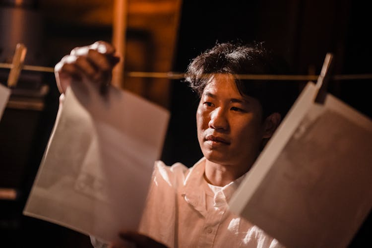 Man In A White Shirt Hanging Photographs