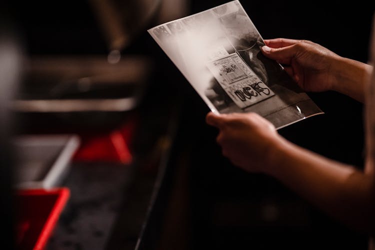 Hands Holding Printed Photograph