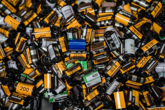 Explore a vast collection of colorful vintage film rolls captured in a detailed close-up.