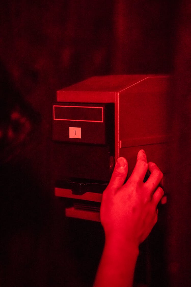 Device In Red Lit Darkroom 