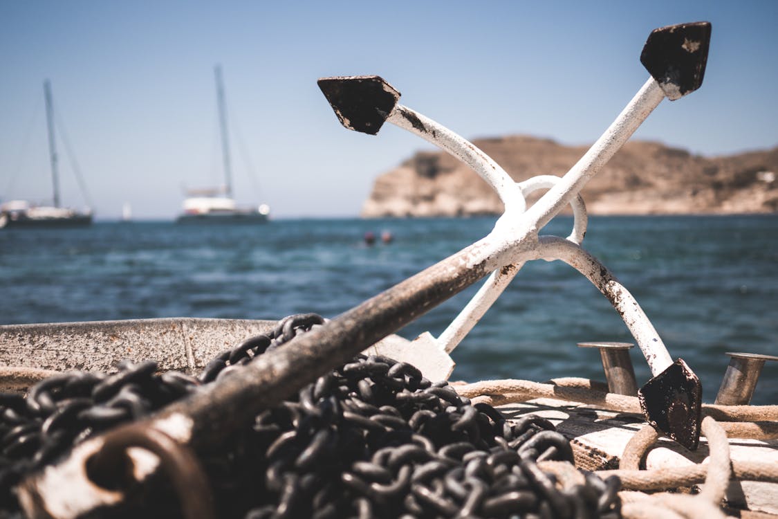 Free White and Black Anchor With Chain at Daytime Stock Photo