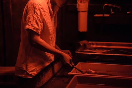 Man Developing Pictures in a Darkroom