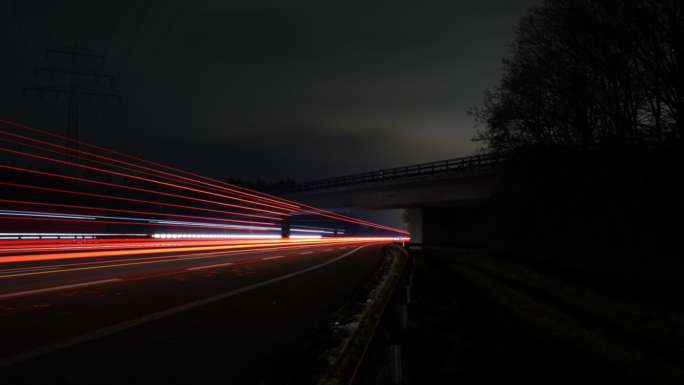Stunning long exposure capturing vibrant light trails on a German highway at night.
