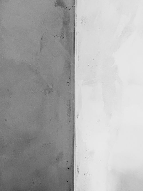 Free Close-up of a minimalist gray and white wall surface, perfect for design projects. Stock Photo