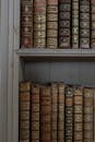 Antique Books Arranged on a Bookshelf