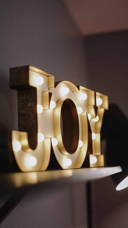 Free Selective Focus Photography of Joy Free Standing Letters With Lights Stock Photo
