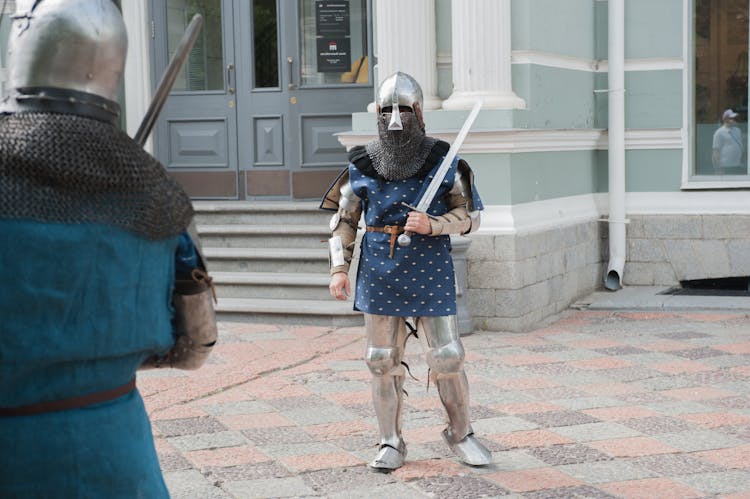 People In Armour In Front Of Building