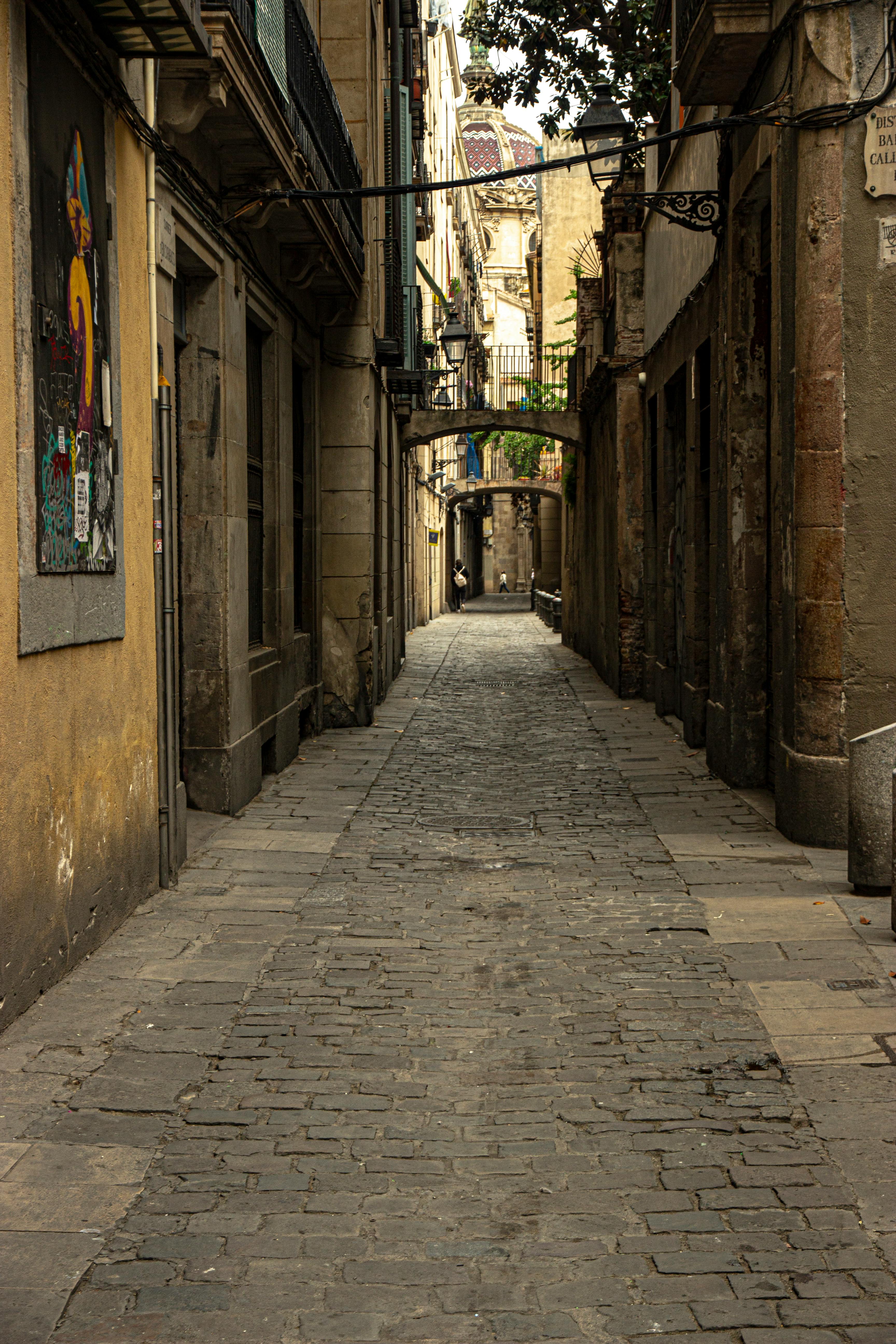 narrow street in between apartment buildings