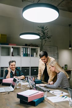 A team works together on a project in a modern office, fostering collaboration and teamwork.