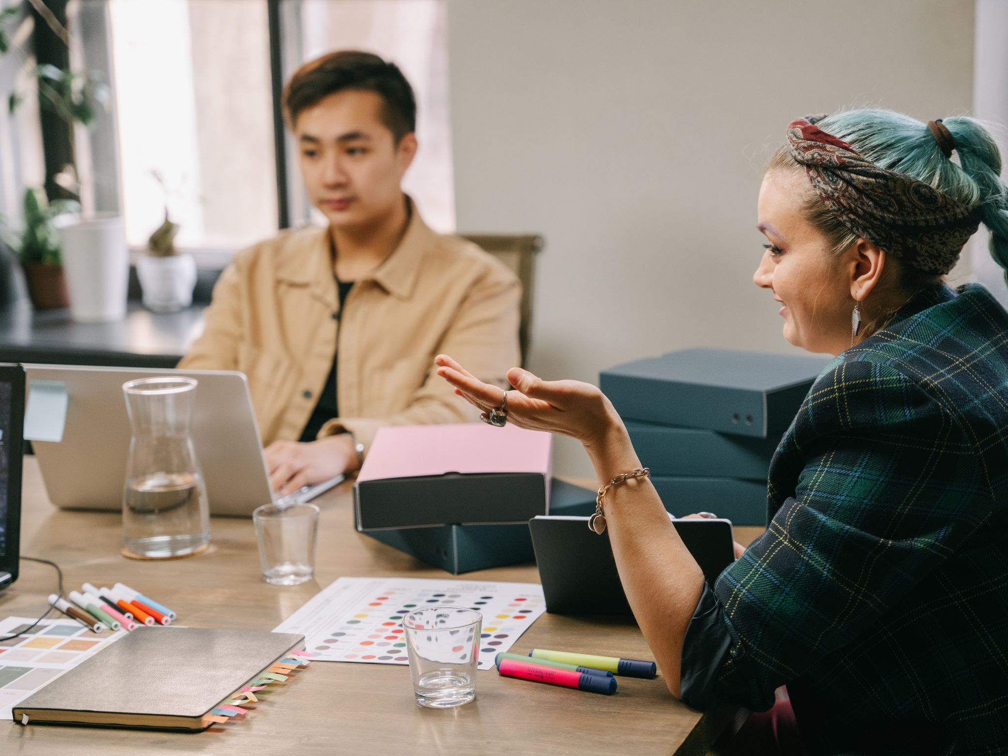 Creative team discussing work in a studio