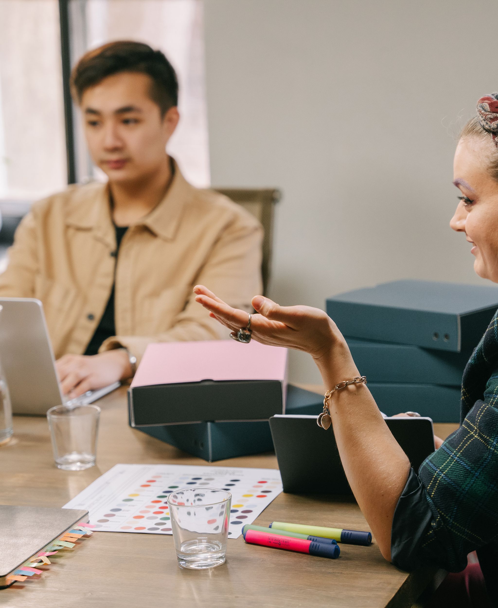 Creative team discussing work in a studio