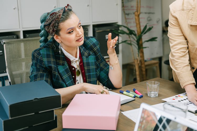 A Female Boss Leading A Business Meeting