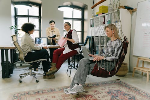 Free Cheerful Colleagues Planning Together in the Office Stock Photo