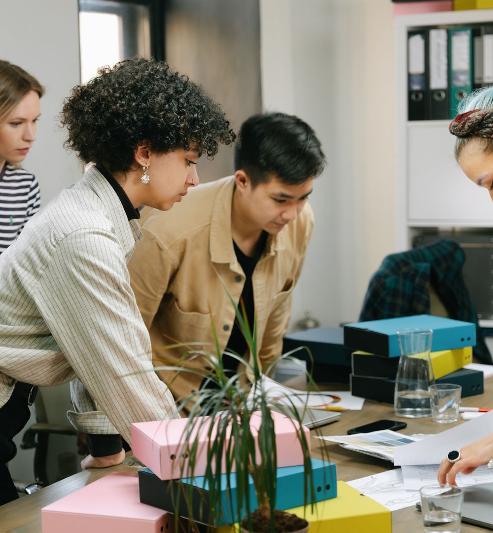 A diverse team collaborating around a table