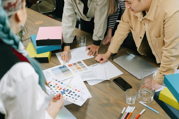 A Group Of People Having A Meeting In The Office