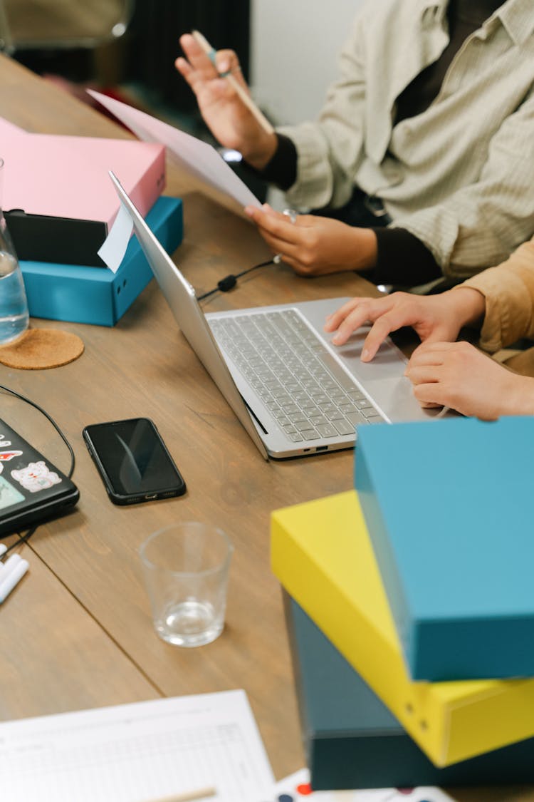 A Group Of People Having A Meeting In The Office